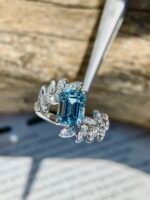 1.08-Carat Emerald-Cut Aquamarine Ring: VVS1 Clarity with Olive Branch Design in 14K White Gold