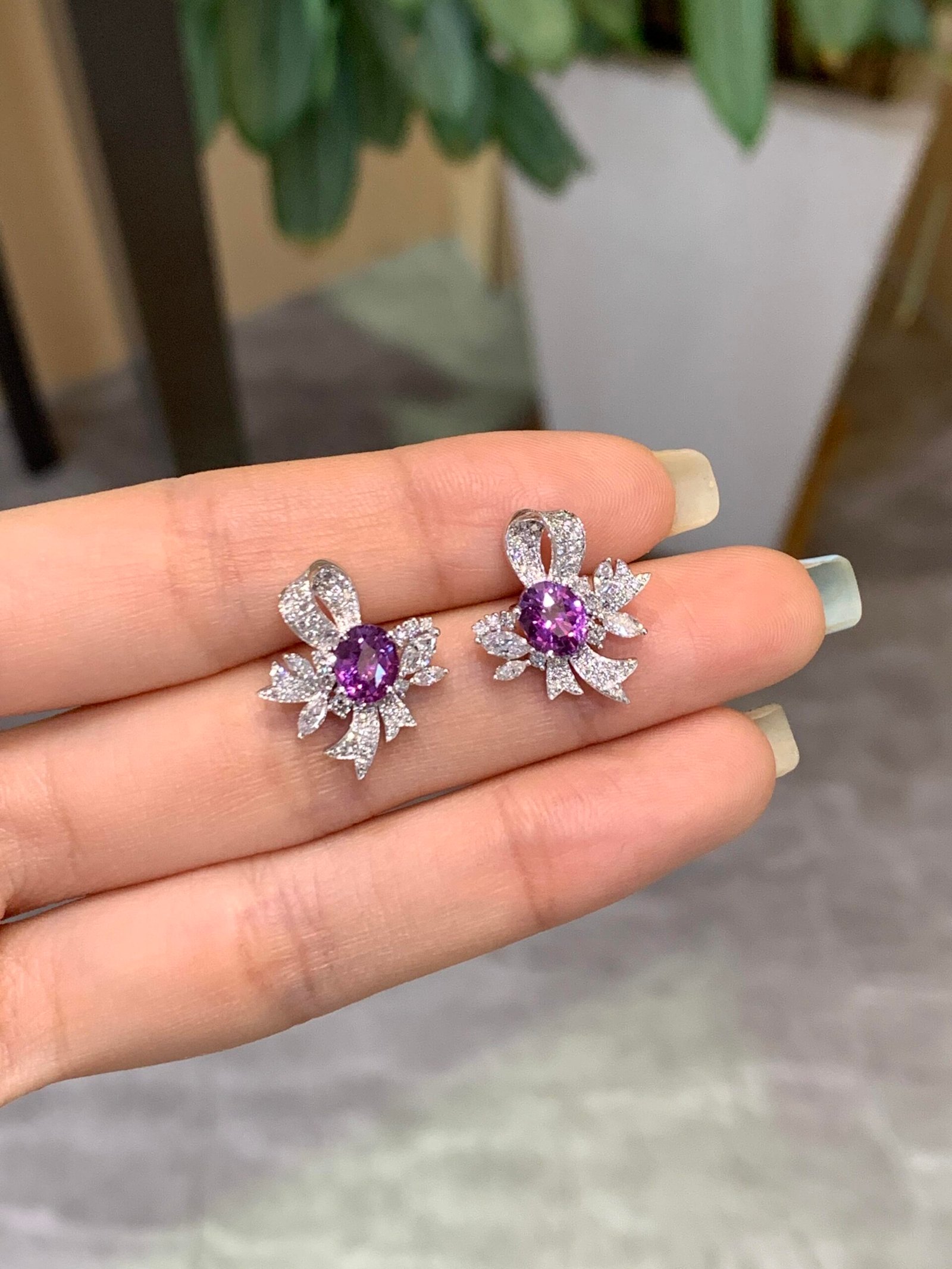81da59e572c2f249da219287ff84ad78 1-Carat Lab-Grown Violet Sapphire Bow-Floral Stud Earrings - Image 1